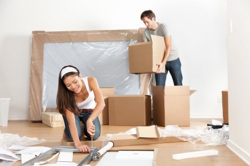 Moving team handling flat removals in a Barbican apartment building