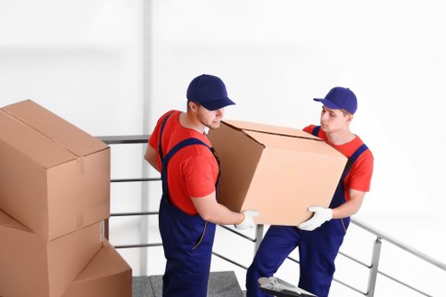 Local removal service preparing fragile items and furniture for transport in central London
