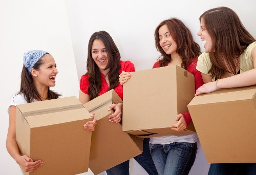 Removal staff loading items carefully for a central London flat relocation