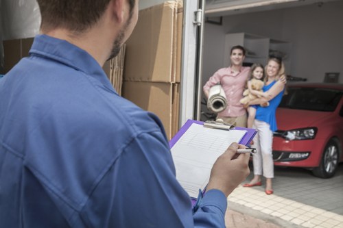 Furniture and boxes being loaded into a removal van in Barbican