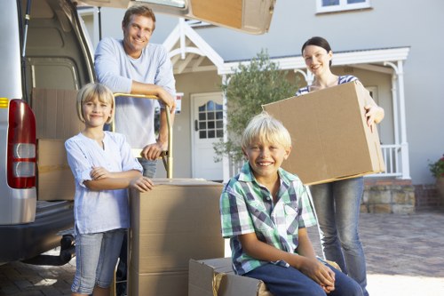 Packed furniture and boxes being secured inside a moving van
