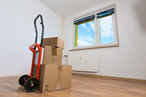 Packed boxes and moving equipment ready for a central London removal
