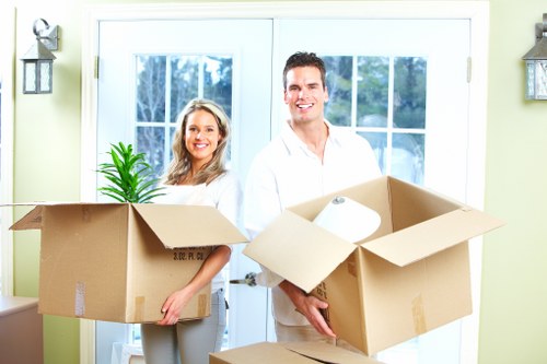 Careful furniture handling during a home move in Barbican