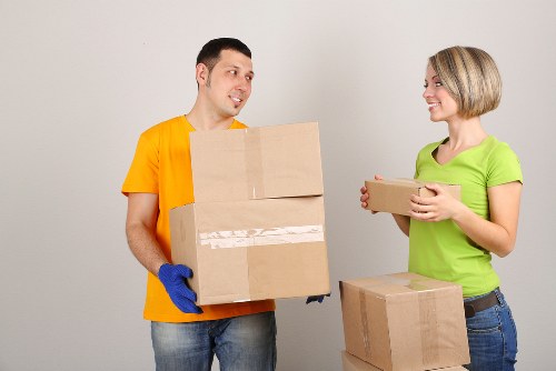 Barbican moving service handling boxes in an urban setting